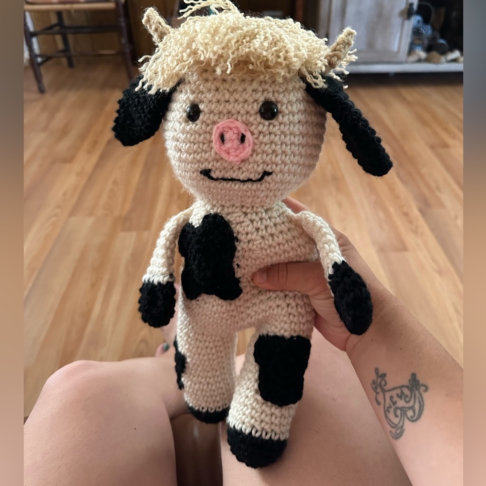 This is a hand crochet mini cow.